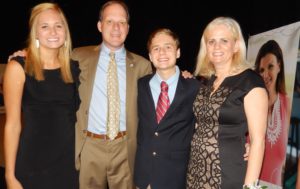 Blue Angel winner Tanja Foil stands next to son, Andy, husband, Franklin, and their teenage daughter.