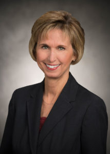 BCBS foundation board member in black blazer.