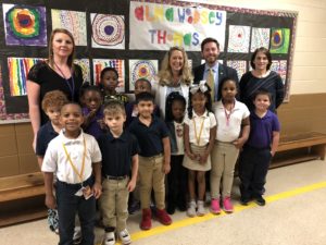 BCBS Foundation members posing with school children.