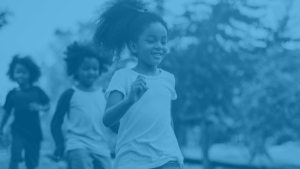 Girl running in park blue.