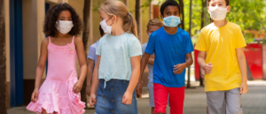 Children walking with masks on.