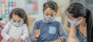 Children with masks on at school.