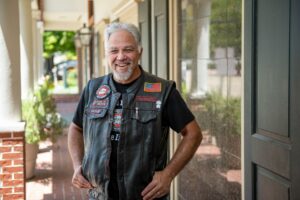 Angel Award Nominee David Longstreet posing in leather vest.